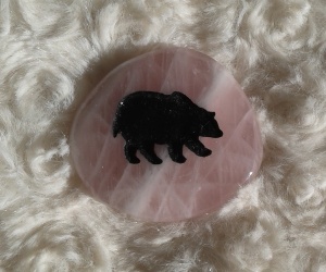 Rose Quartz for healing and a bear for intuition.  I keep this stone by my bed to remind me what energy I need in my life right now.